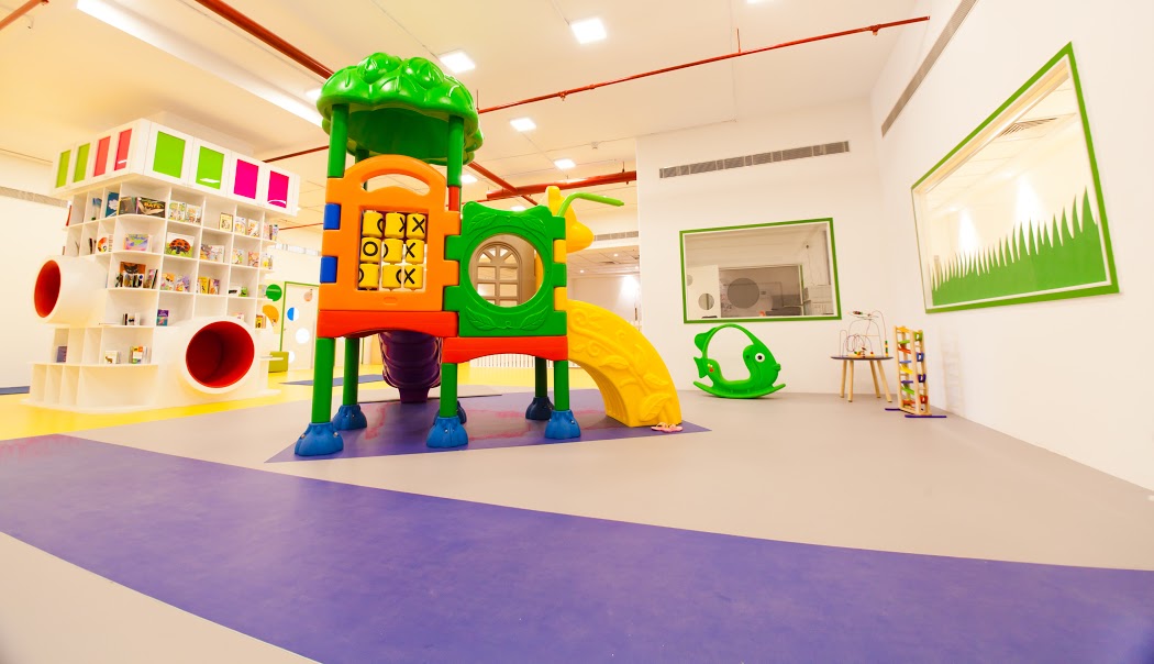 Treehouse play structure and soft-fall zone
