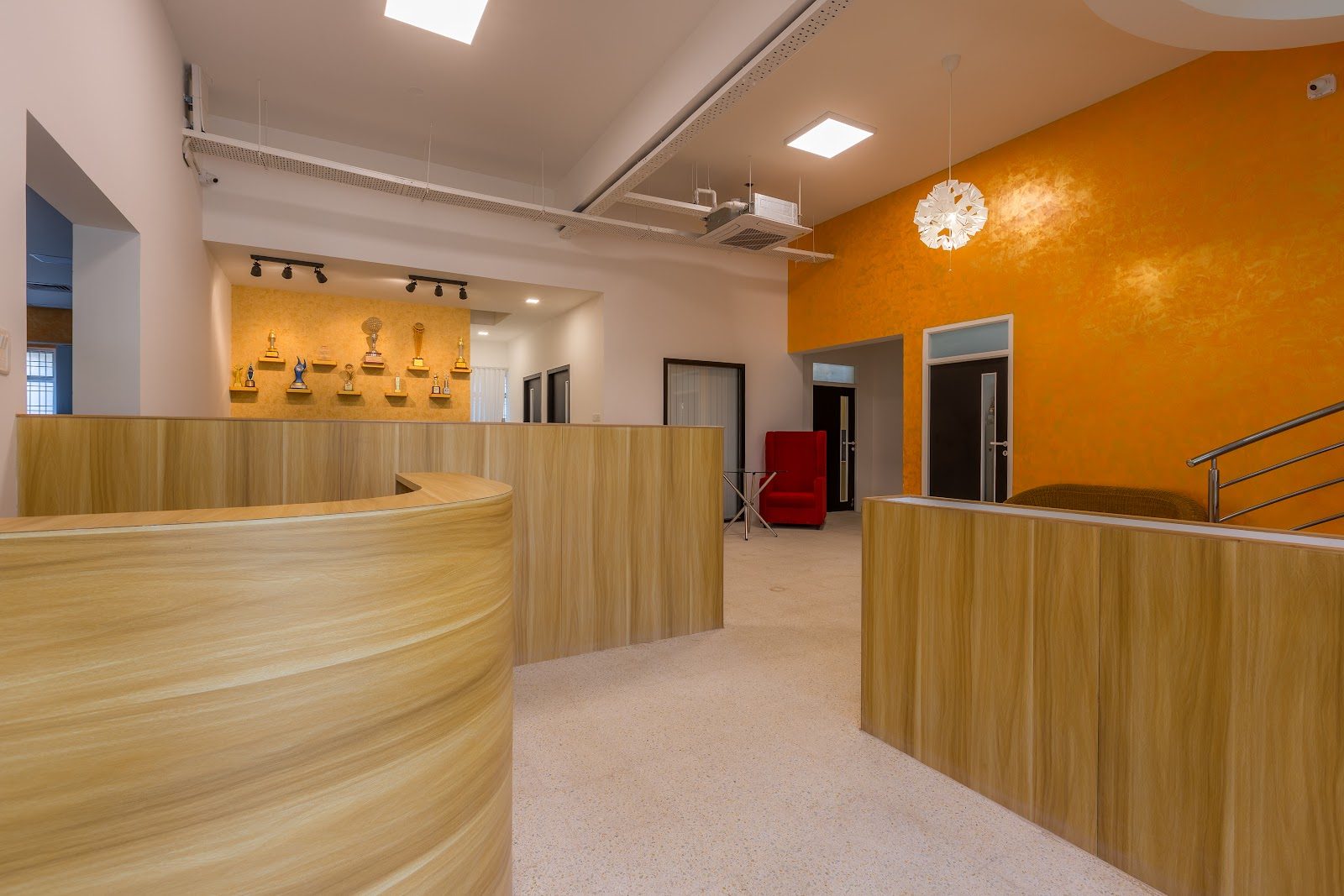 Curved reception counter and awards display wall