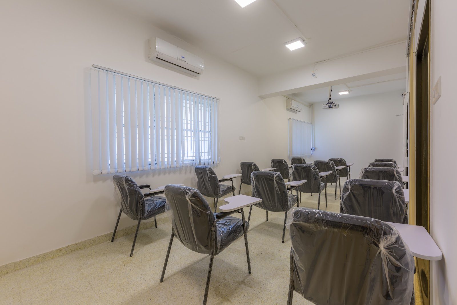 Classroom-format training room with writing tablets