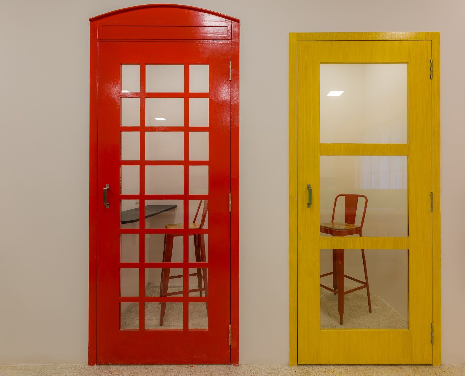 Red and yellow call booths off the work floor